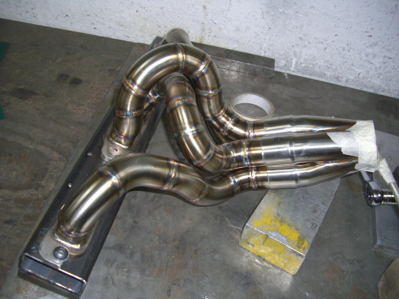 RS Fabrications made some nice headers. As well as the rest of the exhaust system.